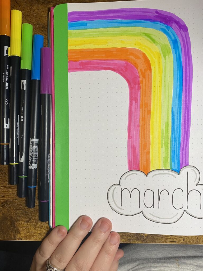 colorful march cover page with a rainbow
